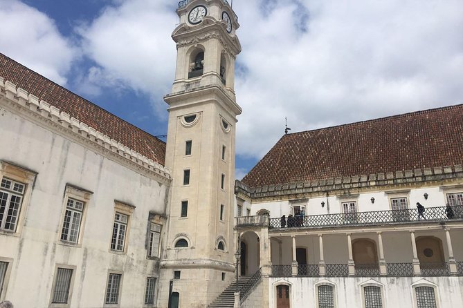 Aveiro and Coimbra Small Group Tour with Moliceiro Boat Cruise - The Manga Garden/Clauster and Church Stop: Small Moments That Add Context