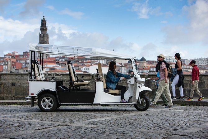 Discover Porto's Highlights on a 2-Hour Private Electric Tuk Tuk - Batalha district stop: theatre vibes and local street life