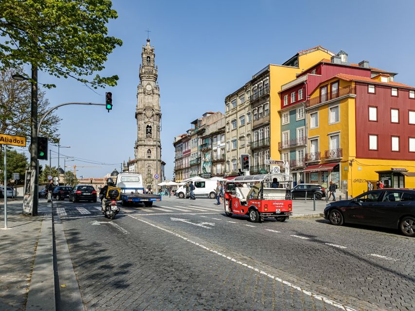Porto: Guided Tour by Tuk-Tuk & Optional Douro River Cruise - Entering Porto’s center on an electric tuk-tuk